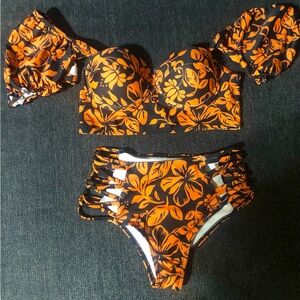 Two piece swimsuit with adjustable sleeves. Size small